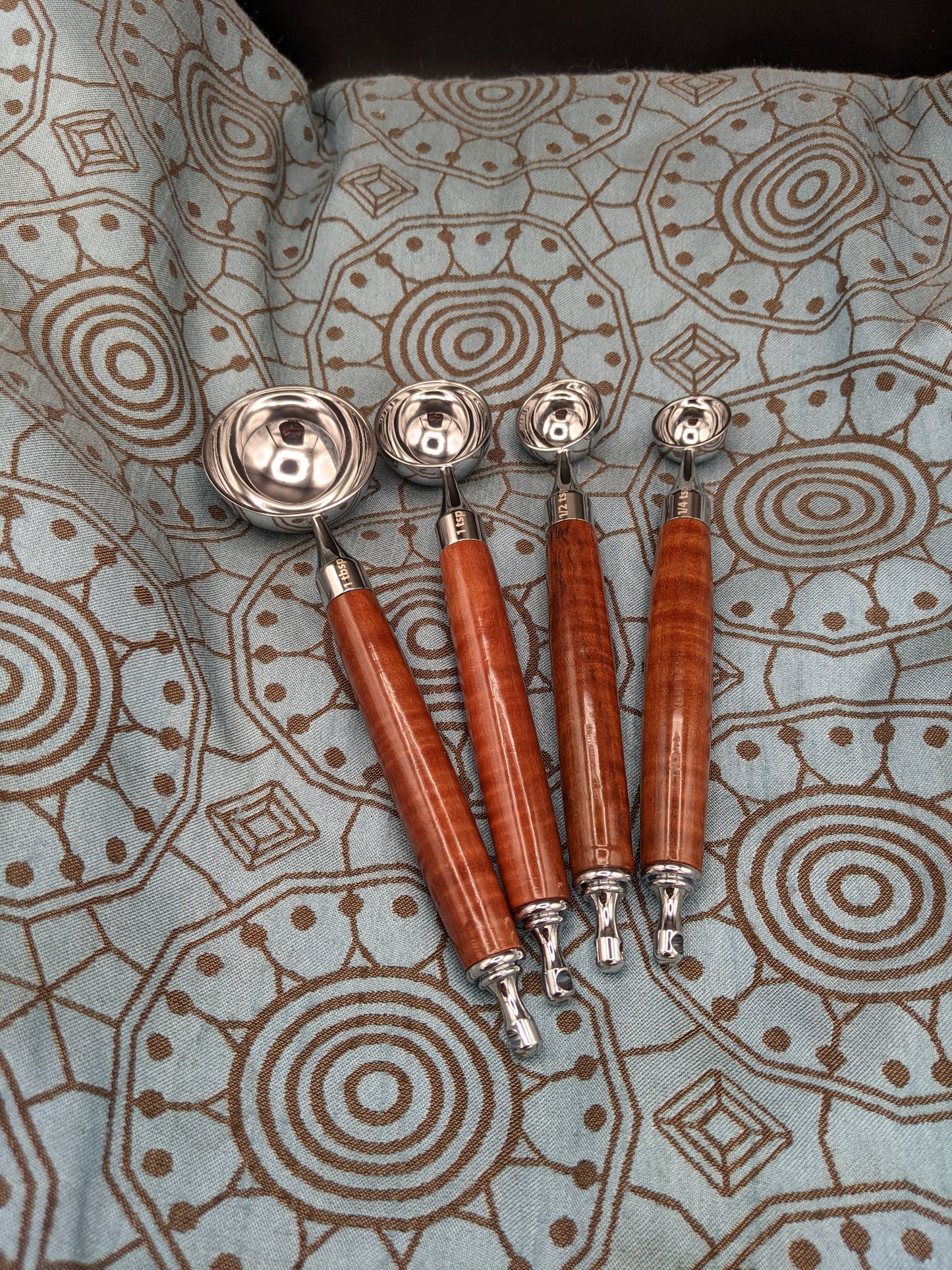 Set of four measuring spoons