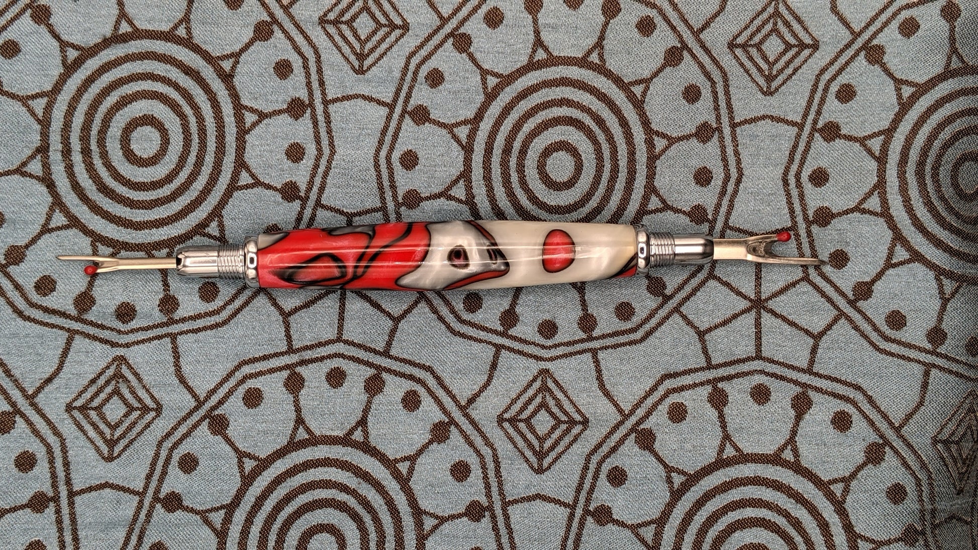 A Gold Plated Double Ended Seam Ripper With Emeri Wood Handle